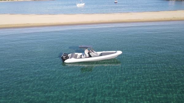 Aerial view of the boat anchored by a Saronic sandbar