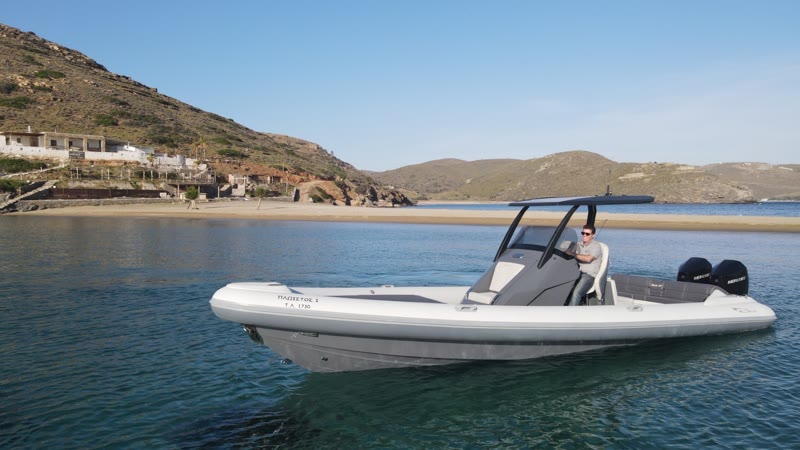 Half day cruise — the Blade 30 moored in a bright turquoise Athens Riviera bay